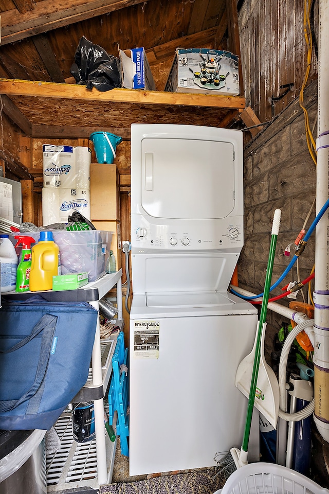 laundry area featuring stacked washer and clothes dryer