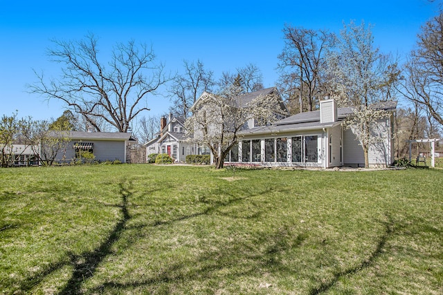 view of yard with a sunroom