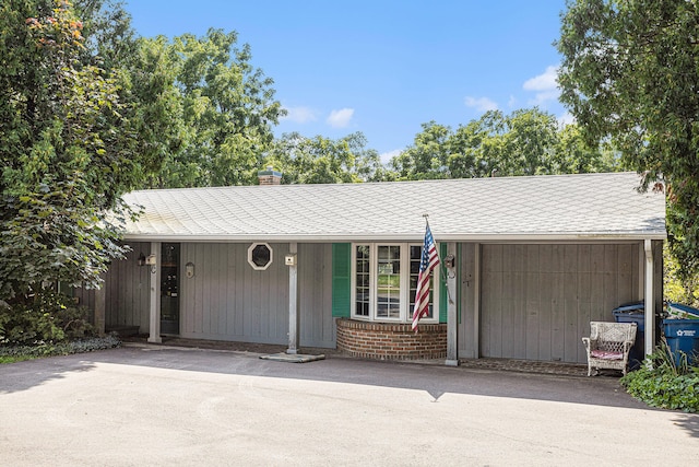 ranch-style home with covered porch