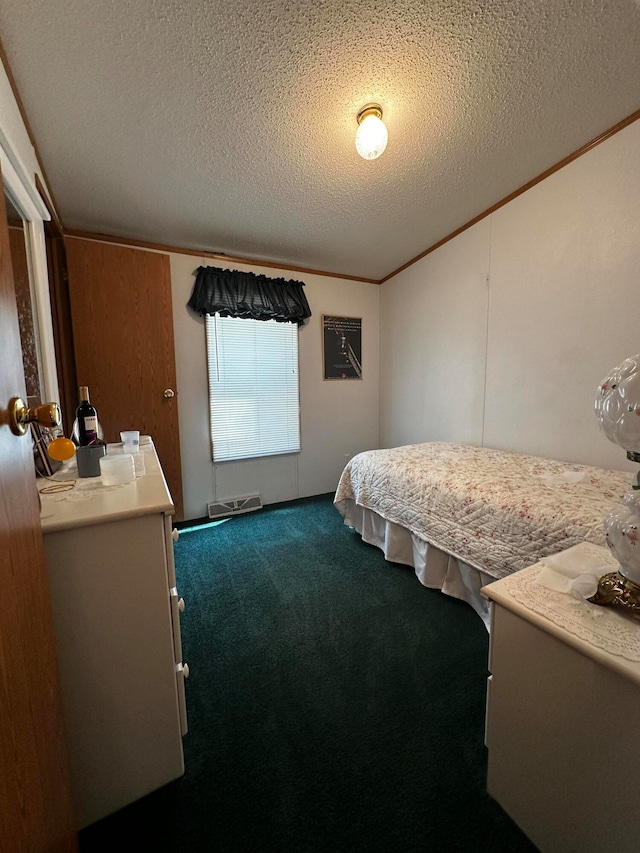 bedroom featuring carpet, ornamental molding, and a textured ceiling