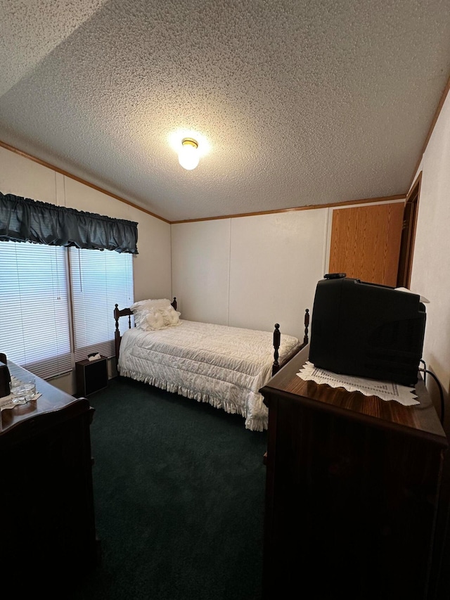 carpeted bedroom with lofted ceiling, a textured ceiling, and ornamental molding