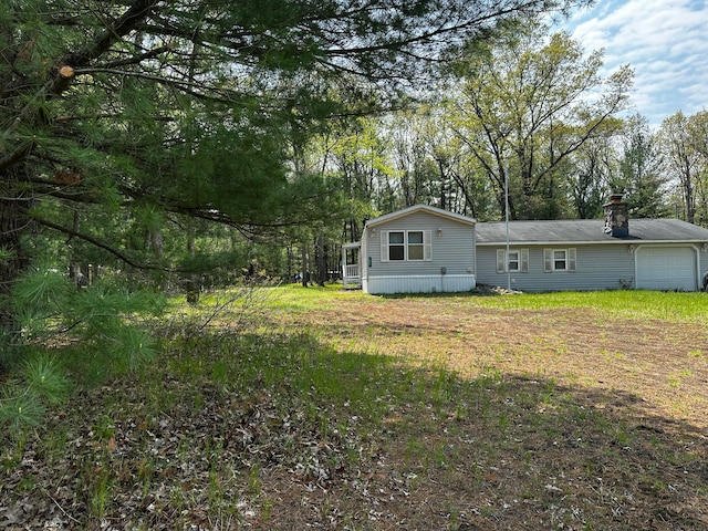 view of yard with a garage