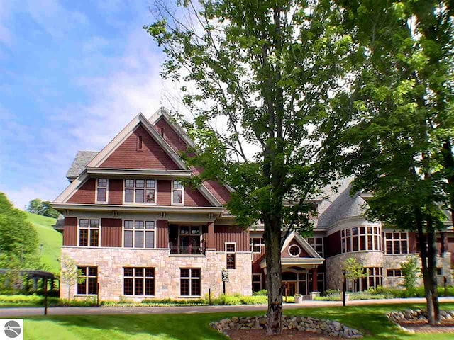 12328-UNIT335B Crystal Mountain Dr, Thompsonville, MI 49683 - living area with wooden walls, wood finished floors, a fireplace, and recessed lighting