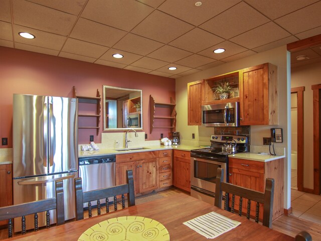 12328-UNIT335B Crystal Mountain Dr, Thompsonville, MI 49683 - living room with wood walls, light wood-type flooring, and a glass covered fireplace
