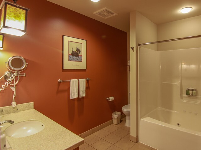 12328-UNIT335B Crystal Mountain Dr, Thompsonville, MI 49683 - bathroom featuring tile patterned flooring, toilet, vanity, and washtub / shower combination