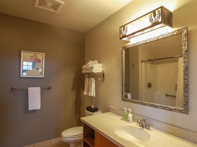 12328-UNIT335B Crystal Mountain Dr, Thompsonville, MI 49683 - full bathroom featuring toilet, vanity, a shower, and tile patterned flooring