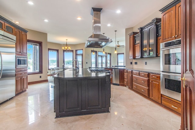 75 Chateaux Du Lac, Fenton, MI 48430 - kitchen with island range hood, built in appliances, dark stone countertops, recessed lighting, and a peninsula