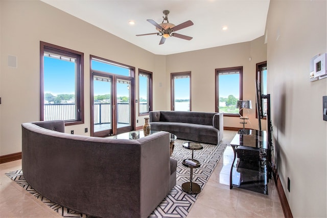 living room with light tile patterned floors and ceiling fan