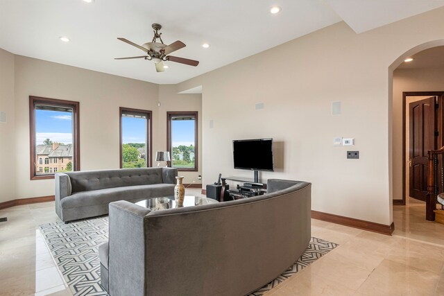 75 Chateaux Du Lac, Fenton, MI 48430 - living area featuring arched walkways, ceiling fan, baseboards, and recessed lighting