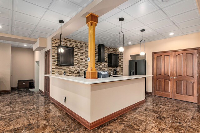 75 Chateaux Du Lac, Fenton, MI 48430 - kitchen featuring black fridge, wall chimney range hood, a peninsula, light countertops, and recessed lighting