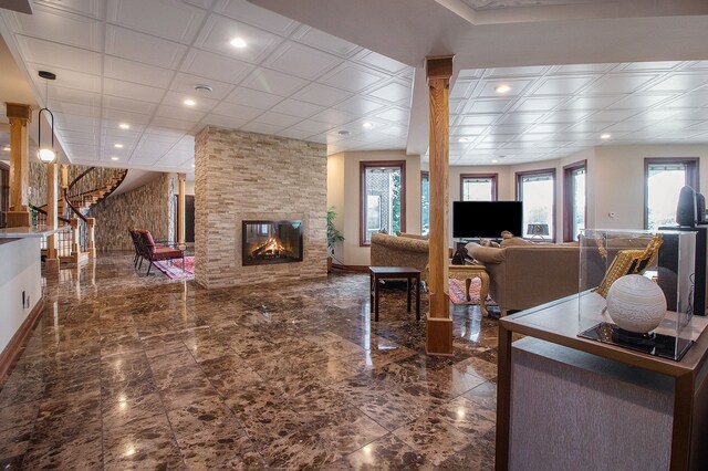 75 Chateaux Du Lac, Fenton, MI 48430 - living room featuring a fireplace, recessed lighting, stairway, and marble finish flooring
