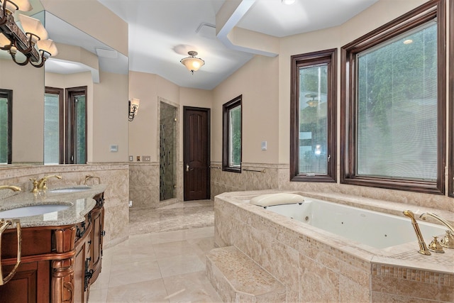 bathroom with tile patterned floors, plus walk in shower, and vanity