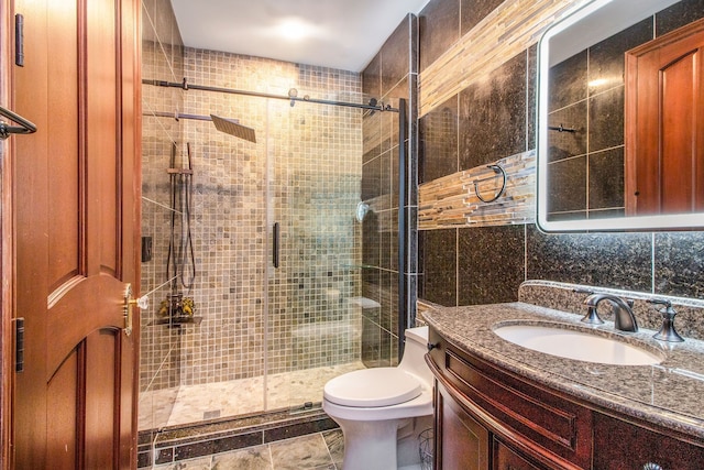 bathroom with tasteful backsplash, an enclosed shower, toilet, vanity, and tile walls