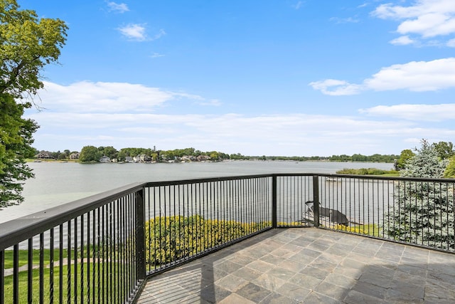 balcony featuring a water view