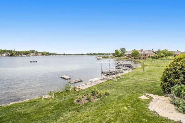 dock area featuring a yard and a water view