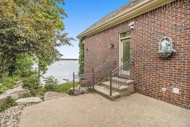 doorway to property with a patio