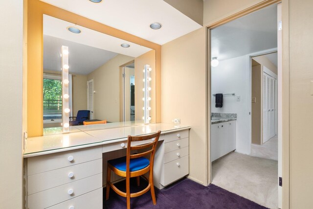 3586 E Huron River Dr, Ann Arbor, MI 48104 - home office featuring dark carpet, built in desk, and recessed lighting