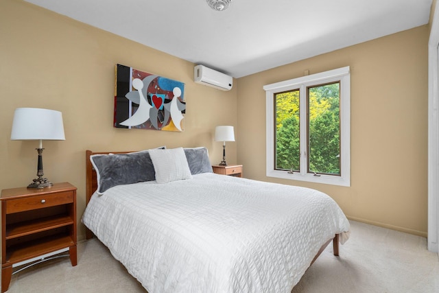 bedroom with a wall mounted air conditioner and light colored carpet