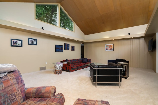 cinema featuring light carpet, high vaulted ceiling, wooden walls, and wood ceiling