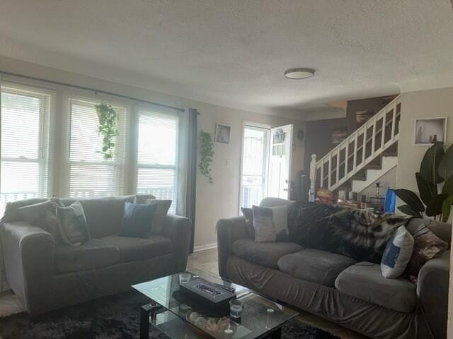 living room with a textured ceiling