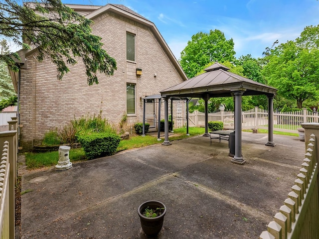 exterior space featuring a gazebo and a patio area