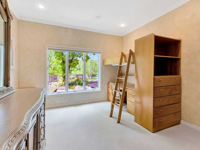 carpeted bedroom with ornamental molding