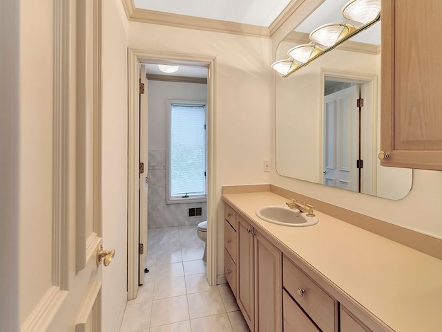 bathroom with tile patterned flooring, vanity, toilet, and ornamental molding