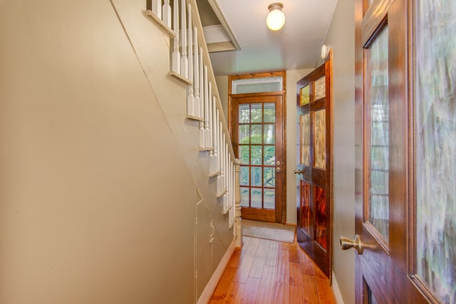 entryway with hardwood / wood-style floors and french doors