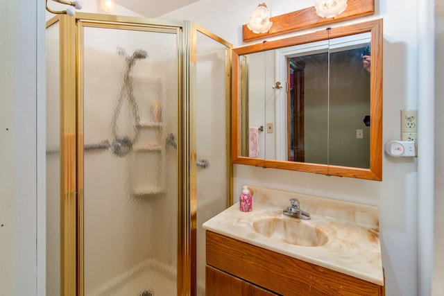 bathroom with vanity and walk in shower