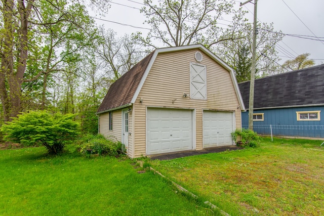 garage with a lawn