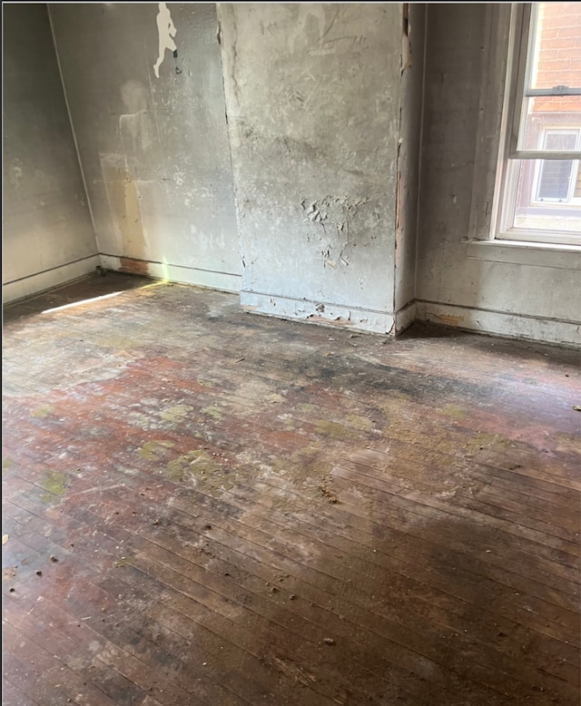 spare room featuring dark hardwood / wood-style flooring