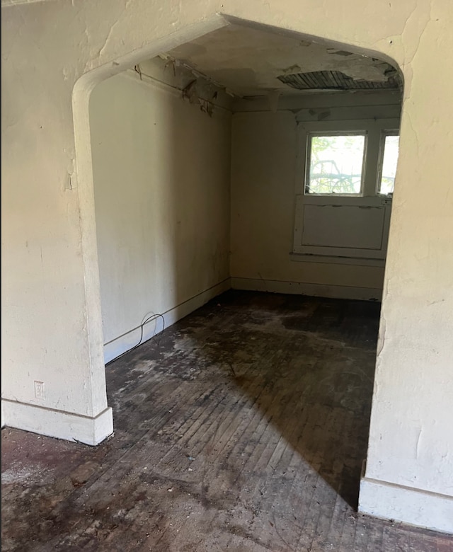 empty room with dark wood-type flooring