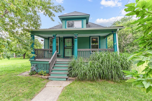 bungalow-style home featuring a porch and a front yard