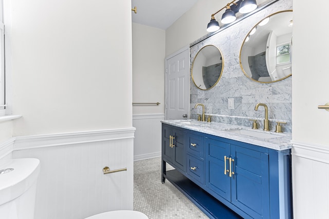 bathroom featuring backsplash, tile patterned floors, vanity, and toilet