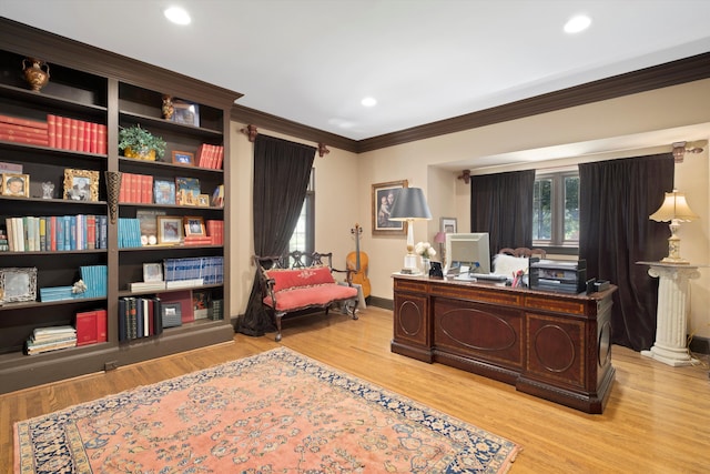 home office featuring light hardwood / wood-style flooring and ornamental molding