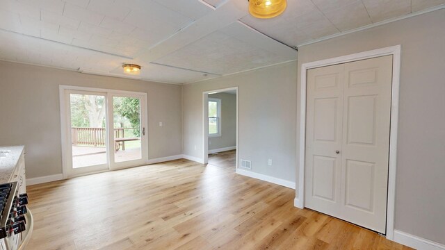 7200 E Tomah Rd, Mount Pleasant, MI 48858 - unfurnished living room featuring baseboards and light wood finished floors
