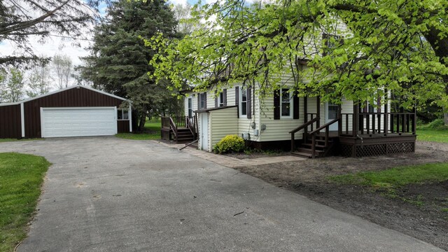 7200 E Tomah Rd, Mount Pleasant, MI 48858 - view of side of property with an outbuilding and a detached garage