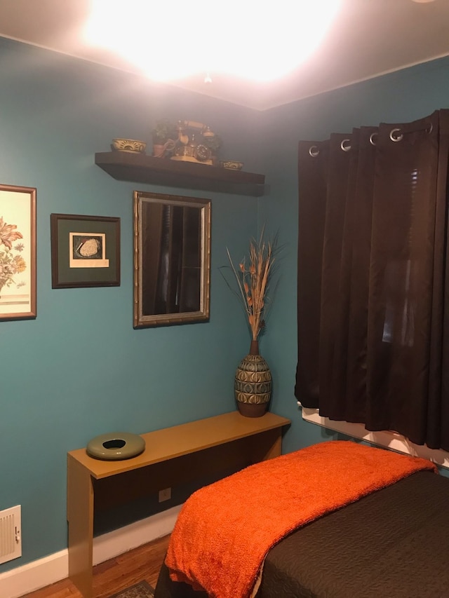 bedroom featuring hardwood / wood-style flooring