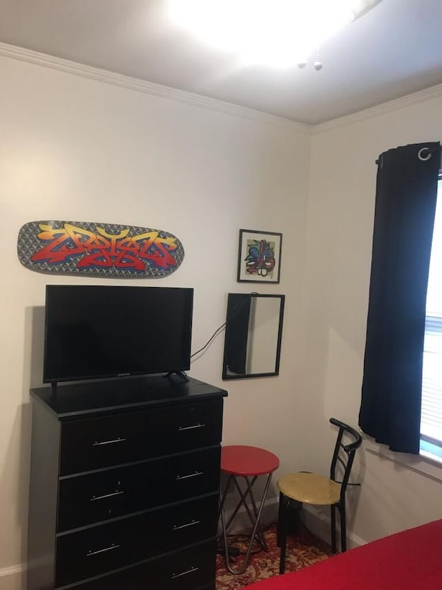 bedroom with crown molding