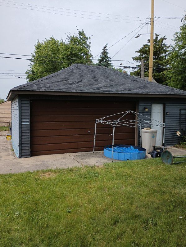 garage with a lawn