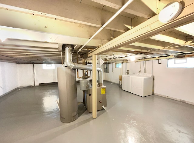 basement featuring independent washer and dryer and gas water heater