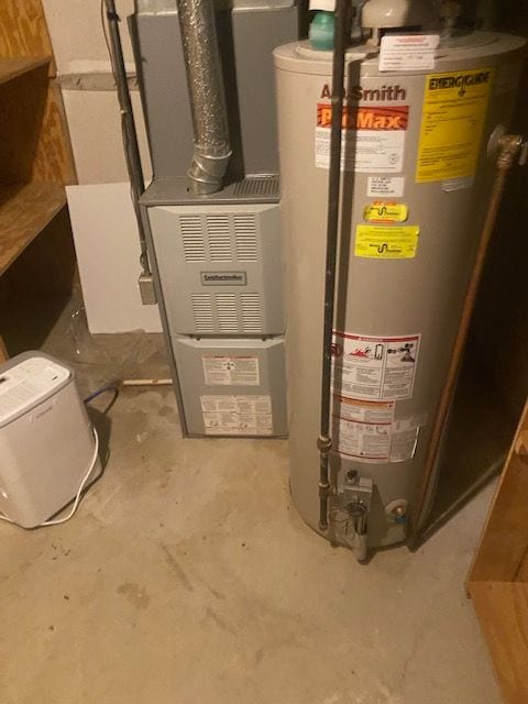 utility room with gas water heater