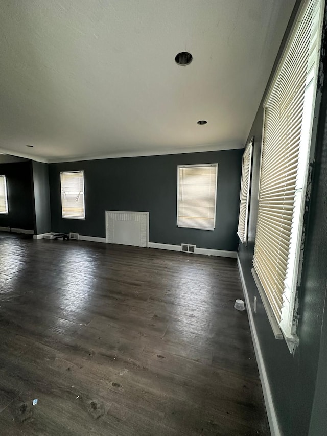 unfurnished room featuring dark wood-type flooring