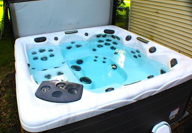 exterior details featuring a jacuzzi