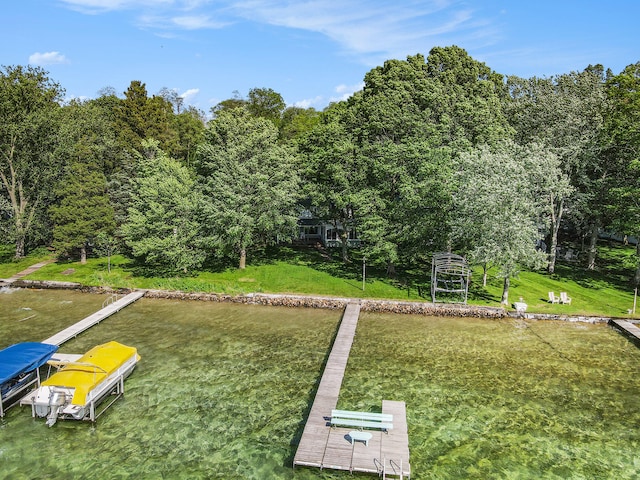 exterior space with a boat dock and a yard