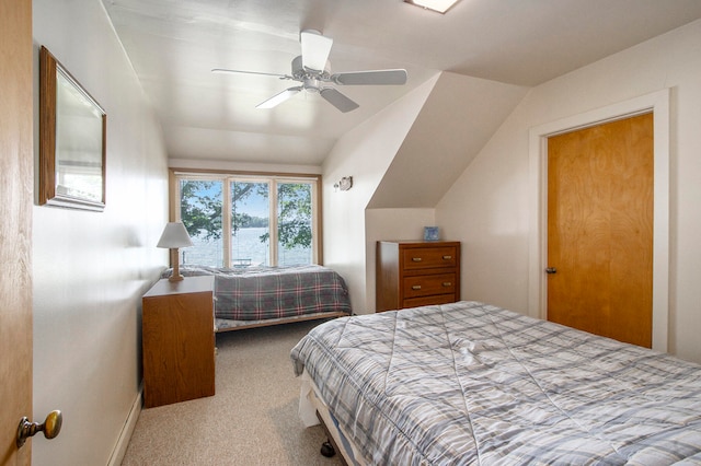 carpeted bedroom featuring ceiling fan and lofted ceiling