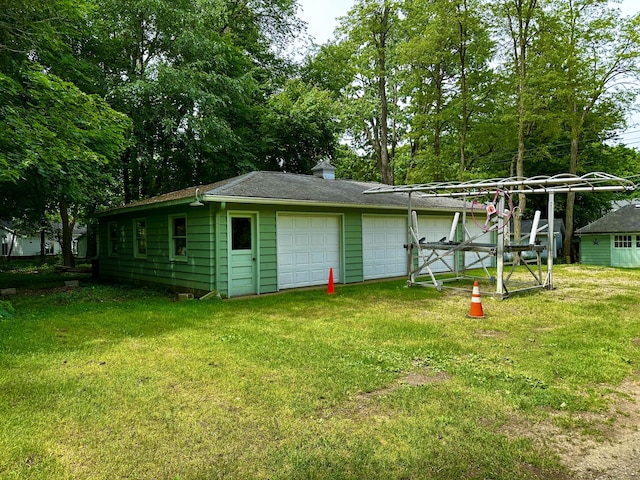 exterior space featuring a yard and a garage