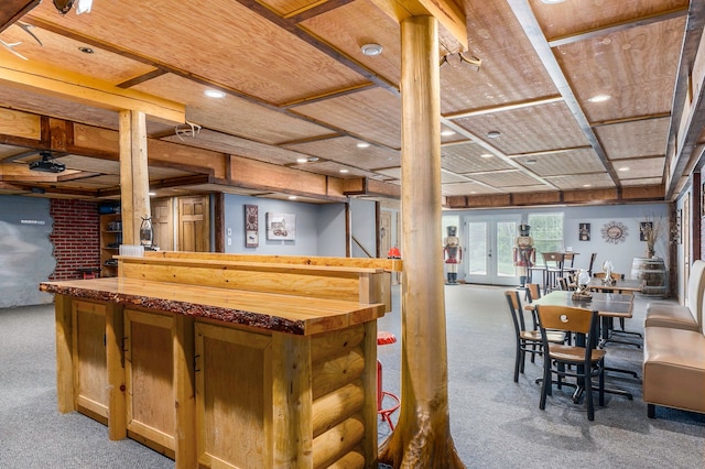 bar featuring carpet, butcher block counters, wood ceiling, and french doors