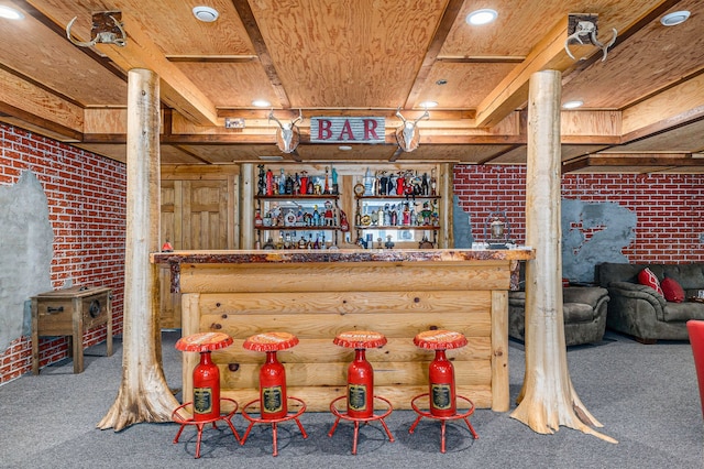 bar with carpet flooring, wood ceiling, and brick wall