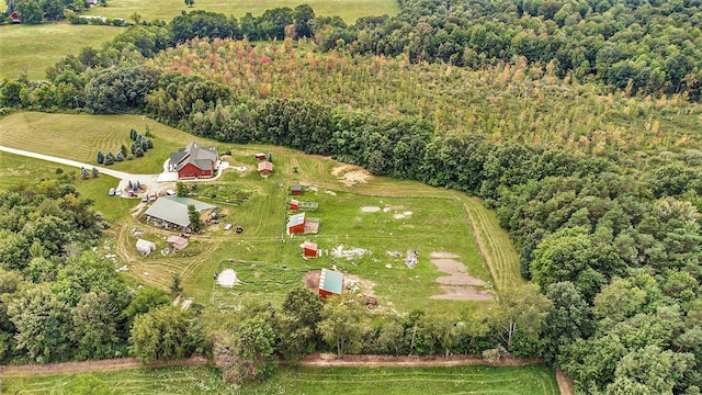 birds eye view of property with a rural view